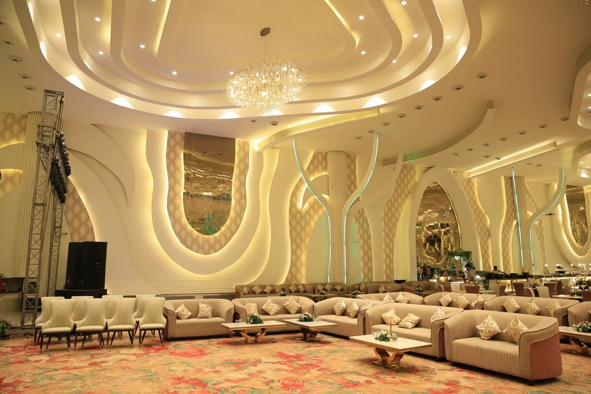 Grand Crystal Chandelier and Floral Ceiling Wedding Decor